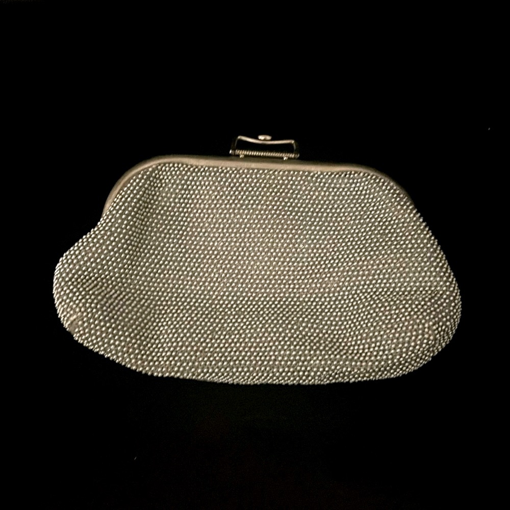 Reversible silver/creme clutch